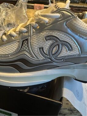 CHANEL Silver and White CC Logo Runner Sneaker